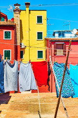 Fototapeta na wymiar Colorful houses and clothes in Burano
