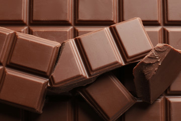 Pieces of tasty milk chocolate, closeup
