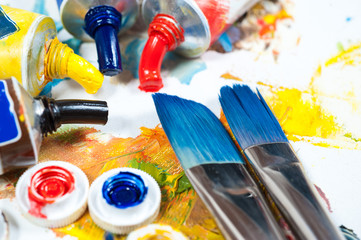colourfull oil paints. brushes and palette knife.