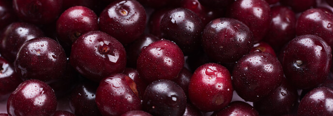 Banner concept summer. Close up of scattered of ripe cherries. Large collection of fresh red cherries. Ripe cherries background. Design Copy Space Top View Flat Lay Close-up.