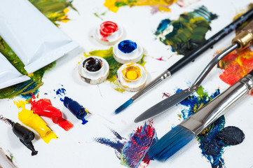 colourfull oil paints. brushes and palette knife.