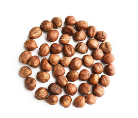 Tasty hazelnuts on white background
