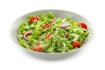 Plate with quinoa salad on white background