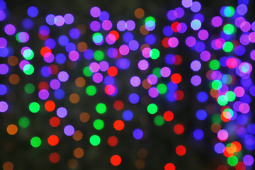 Blurred Christmas lights on dark background