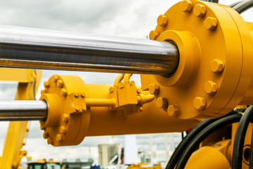 pipes and the hydraulic system of the tractor or excavator.Focus on the left side of the frame on...