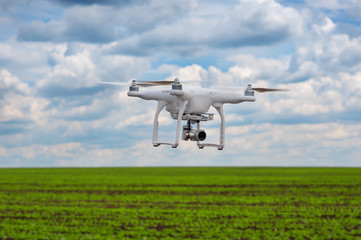 Fototapeta na wymiar flight of quadrocopter over bean field
