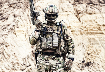 Army soldier, private military company fighter with hidden identity in battle uniform, helmet, body...