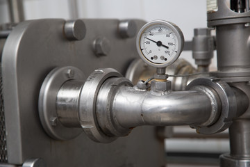 Metallic Stainless Steel Pipes  In Modern Dairy Plant Closeup