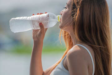 Asian teenage girl with bottle of drinking water, healthy, fresh, clean, pure water concept.