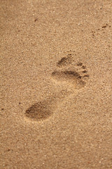 Fototapeta na wymiar Footprint in beach sand