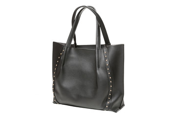 Naklejka premium black female bag with handles, decorated with gold rivets, isolated on white background
