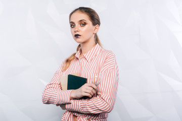 young writer girl having idea. young woman holding electric lamp in her hand in office.business woman has ideas for her business job