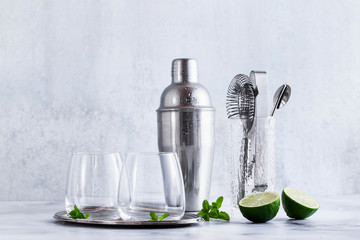 bar accessories on the table and two glasses of ice. tools for the restaurant