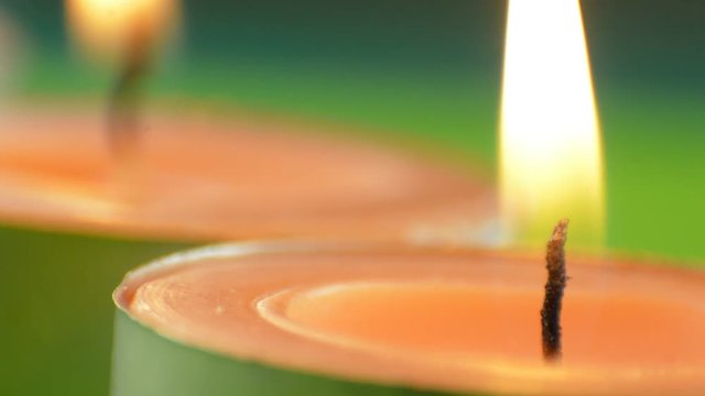 Tea candles burning, macro view