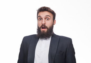 Shocked bearded man in black suit