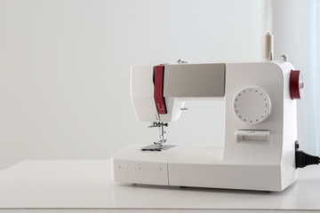 Sewing machine on table indoors