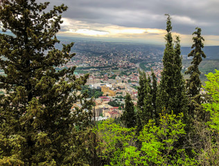 Fototapeta na wymiar A breathtaking view of the city from the Mtatsminda Park on funicular in Tbilisi