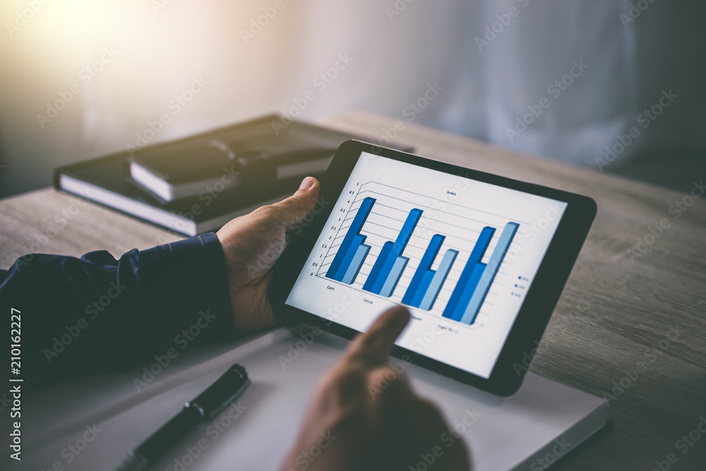 Poster professional at work, businessman using tablet working analysis investment connection at modern work