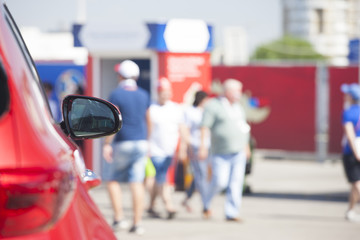 Abstract blurred image of football fans in the fan zone for background