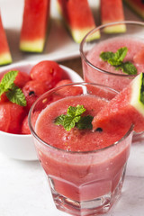 Watermelon drink in glasses with slices of watermelon