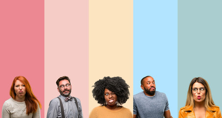 Cool group of people, woman and man making funny face fooling