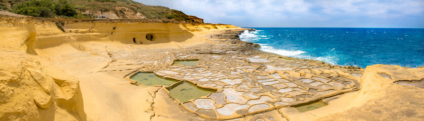 Panoramic view of Salt evaporation ponds, also called salterns or salt pans located near Qbajjar on the maltese Island of Gozo.