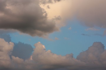 Fototapeta na wymiar Dark and light clouds in sunny sky