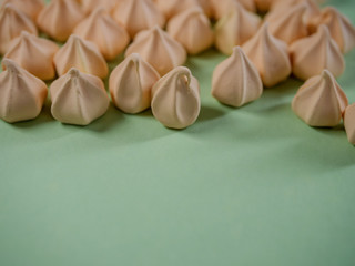 Colorful meringues, arranged on the side of the page with a place for text