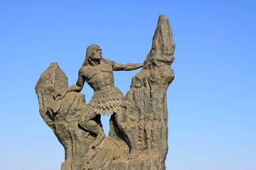 figure sculpture in the blue sky background