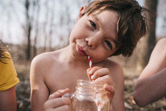 Close-up of a boy enjoying a summer drink