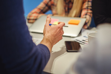 Mans hand in explaining gesture while in the meeting