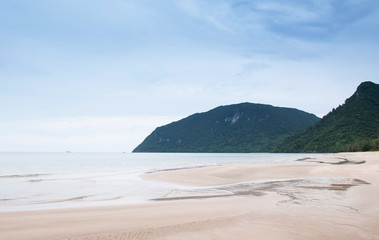 Fototapeta na wymiar Peaceful beach of southern Thailand, Samui island far in background. Khanom, Nakhon Si Thammarat