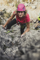 A Woman Climbing a Rock