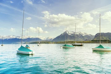 Papier Peint photo Lavable Naviguer Sailing boats at lake Thun ( Thunersee ) infornt of Alps mountain in the evening