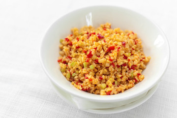 Arabic traditional cuisine - Couscous with tomato and green onion