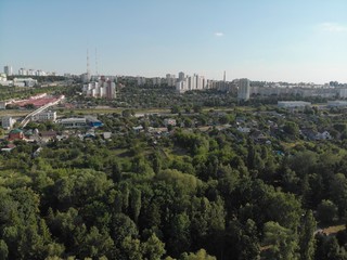 flight over the river in a city park among trees