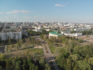 Fototapeta premium flight over the river in a city park among trees