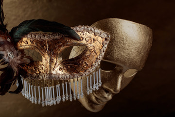 Two golden carnival masks .