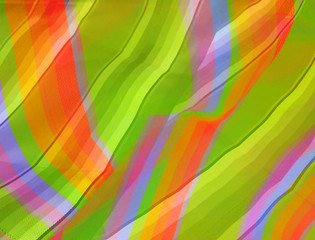 Abstract colorful background created by using rainbow fabric pattern mix to new pattern and new color.