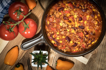 Chili con carne in a clay pan.