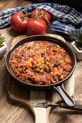 Chili con carne in a clay pan.