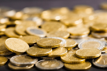 Close-up to stacks and heaps of Euro money coins