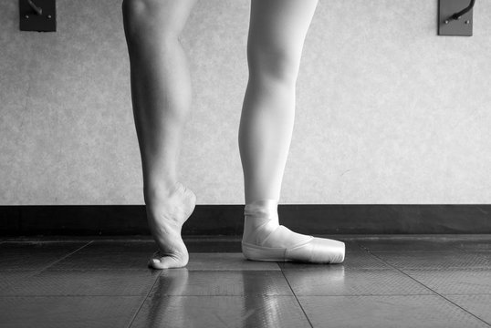 Black and white version of Behind the Ballet dancer's pointe shoes 