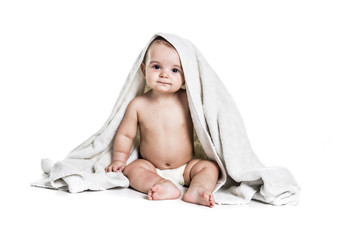 Baby boy portrait on white background with bath towel over his head