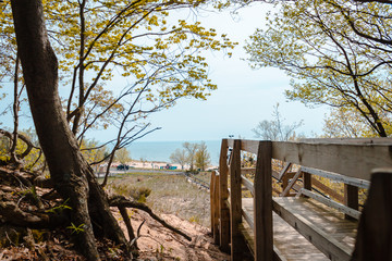 Fototapeta na wymiar Looking out from the wooded part of the boardwalk at Lake Michigan