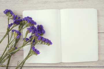 Blank Mockup Open Notebook Paper and Flower. template for input message advertising.