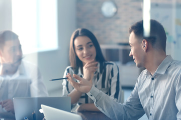 Fototapeta premium Young people having business meeting in office, view through glass