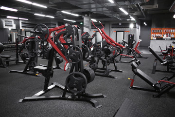Fototapeta na wymiar Modern equipment in new gym indoors