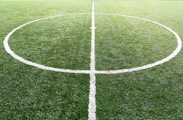 football field ,soccer field , green grass and White line ,White stripe .