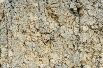 Textured stone background Rubble ballast in natural form in the rock wall
